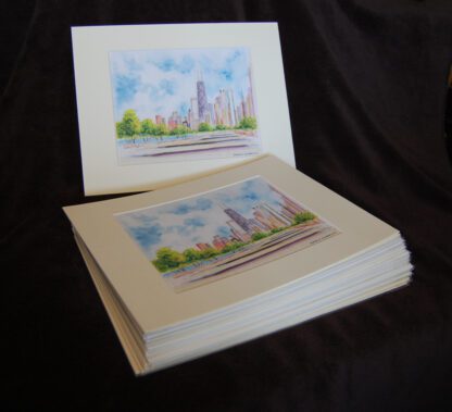 Stack of matted skyline prints for volume orders