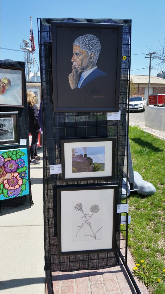 Artwork panels showcasing current works at May Fest.