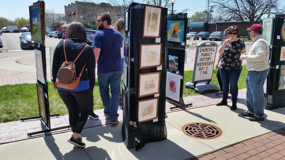 Artwork panels showcasing current works at May Fest.