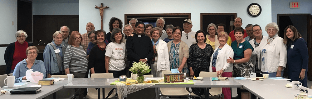 Group photo for Father Jose with prints.