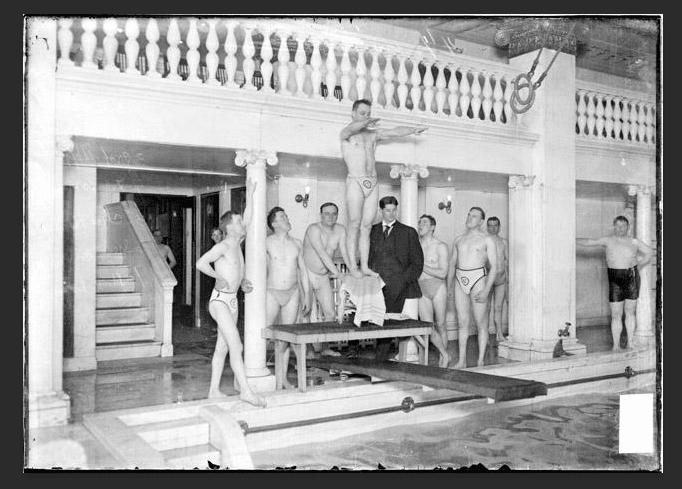 Members of the Chicago Athletic Association taking diving lessons at the pool.