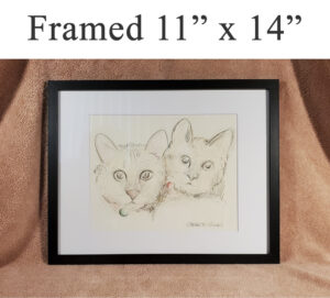 Framed pet portraits at Condren Galleries.