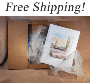 Matted landscape print in a shipping box.