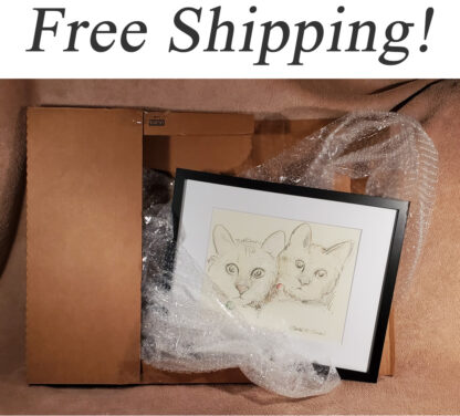 Framed pet portrait and animal prints in a shipping box.