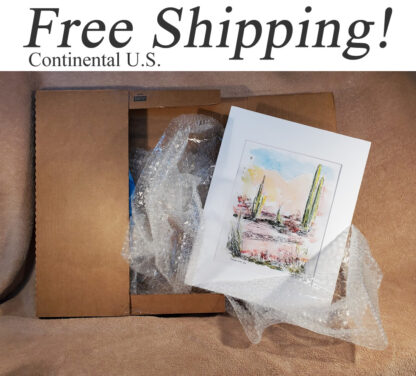Shipping box with landscape, and seascape prints.