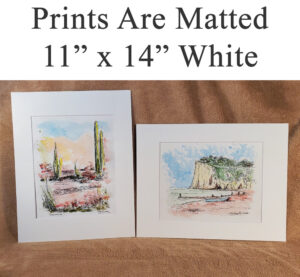 White matted landscape prints.