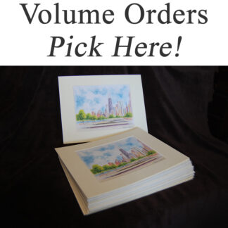 Stack of white matted skyline, city scene, and cityscape prints.